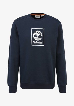 Mörkblå sweatshirt med ribbstickade muddar och fåll; har en vit Timberland-logotyp centrerad på bröstet inom en rektangulär kontur.