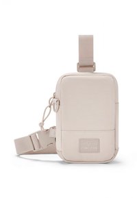 Beige, rectangular crossbody bag with a smooth fabric texture, adjustable strap, and a front label patch. Zipper closure and side hardware detail.
