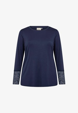 Tengerészkék hosszúujjú póló sima anyagból, csipke díszítéssel a mandzsettákon. Kerek nyakú és laza szabású.