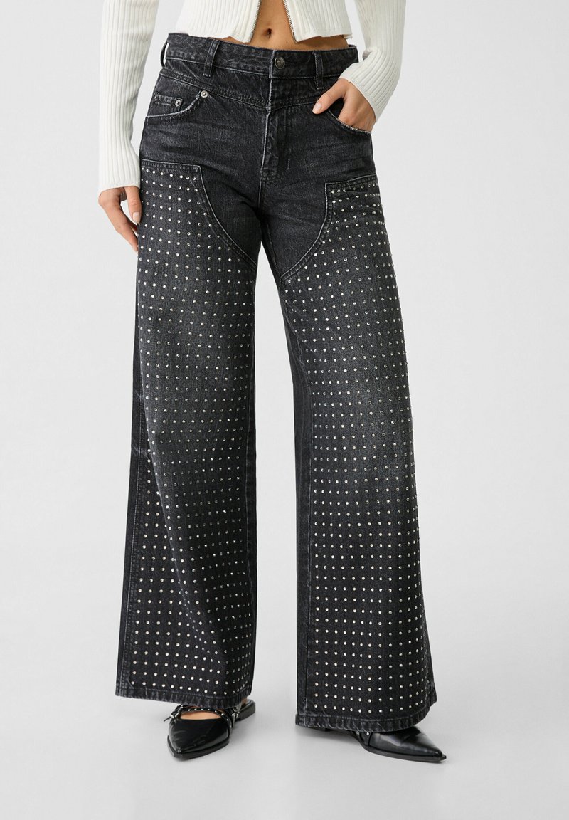 Flared jeans with rhinestones main image 0