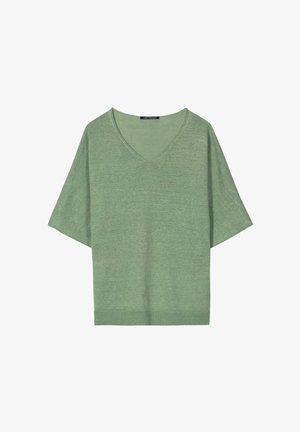 Green short-sleeve knit top with V-neck and loose fit, featuring a ribbed hem and a clothing label at the neckline.