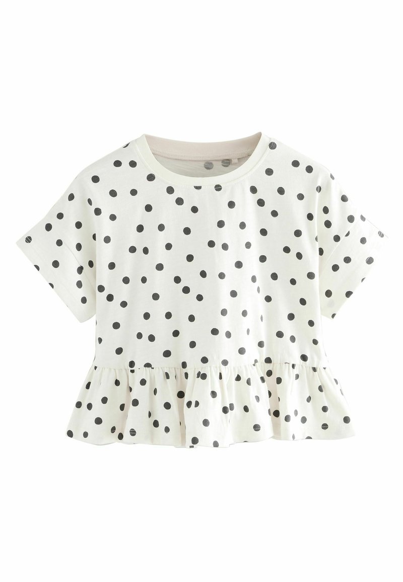 Hvid kortærmet crop top med sorte prikker og flæser nederst.