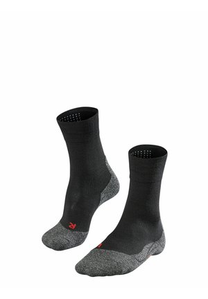 Chaussettes noires mi-mollet avec un embout et un talon gris texturé, un soutien de voûte plantaire renforcé et des détails en rouge près du rebord.
