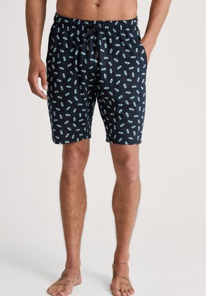 Marineblaue Schwimmshorts mit einem wiederholten hellblauen Flaschenmuster, elastischem Bund mit Kordelzug, knielang, aus leichtem Stoff.
