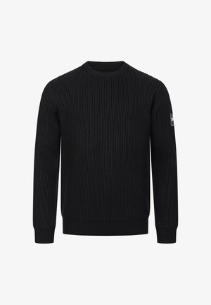 Juodas raštuotas megztinis su apvaliu iškirpimu ir ilgomis rankovėmis. Kairėje rankovėje yra logotipo emblema. Lygus paviršius su elastingais rankogaliais.