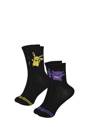 Zwei Paare schwarze Crew-Socken, eines mit gelbem Pikachu und gelben Streifen, eines mit lila Gengar und lila Streifen nahe den Zehen.
