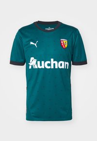 Tealfärgad sporttröja med svarta accenter, med ett upprepat mönster, Puma-logotyp och sponsorns logotyp "Auchan", samt lagets klubbmärke.