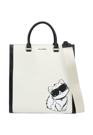 Sac fourre-tout blanc et noir avec poignées et bandoulière noires, avec un chat de dessin animé portant de grandes lunettes de soleil noires en bas à droite.