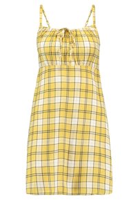 Keltainen ruudullinen mekko säädettävillä olkaimilla, rypistetty vartalonosa ja kevyesti levenevä helma. Kuvioinnissa on harmaita ja valkoisia ruudukkojuovia.