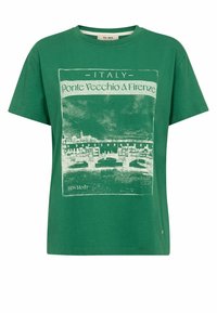 Zelené bavlnené tričko s grafickým potlačou mosta Ponte Vecchio vo Florencii, s bielym textom uvádzajúcim "Taliansko" a lokalitu.