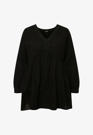 Černá tunika s dlouhými rukávy, vyrobená z texturované látky. Má výstřih do V s ozdobným šitím a vrstvený spodní okraj.
