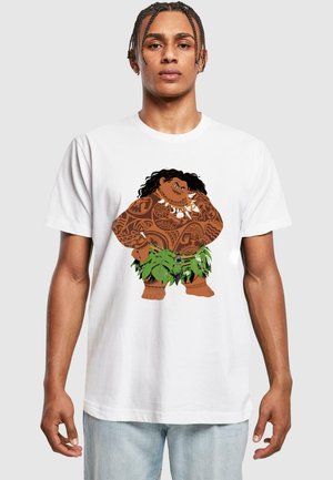 White t-shirt featuring a cartoon character with dark skin, black curly hair, tribal tattoos, and a green skirt made of leaves.