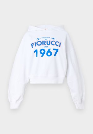 White cropped hoodie with long sleeves, featuring blue and red text design: "DREAMING OF FIORUCCI SINCE 1967" and two blue accents.