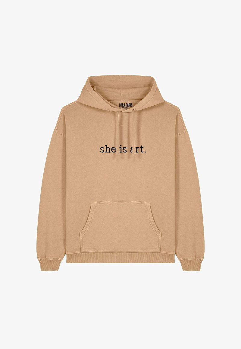 Bežinė gobtuvinė striukė su kengūros kišene. Juodais rašmenimis ant priekio užrašyta "ji yra menas". Minkšta tekstūra, laisvas kirpimas ir raukiniai ant rankovių.