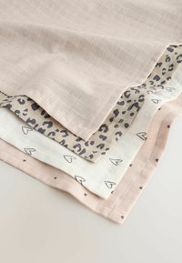 Set of four fabric swatches: light pink with grid pattern, beige with leopard spots, cream with small hearts, and pale pink with tiny dots.