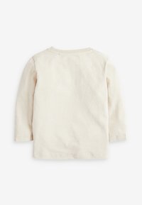 Plain light beige long-sleeve shirt shown from the back with a round neckline and simple stitching details.