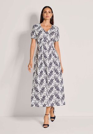 Maxikleid mit Blumenmuster in Marineblau und Weiß, kurzen Puffärmeln, V-Ausschnitt und einem fließenden Rock mit geraffter Taille.