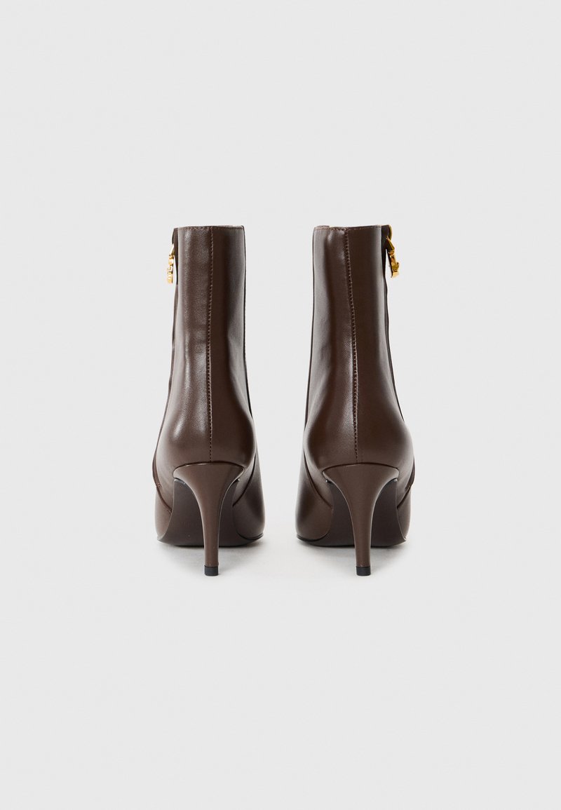 Mini jupe en cuir noir vintage taille 36/38 - Vêtements