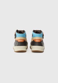 High-top sneakers with a black leather base, blue mesh accents, orange logo, and a light beige midsole; textured brown rubber sole.
