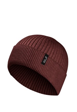 Dark red ribbed knit beanie with folded cuff and a small black label featuring white brand text and paw print logo.