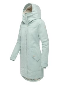 Mintfarvet lang frakke med høj krave, foran knapper, to forlommer og blød tekstur. Foringen har en mønstret detalje.
