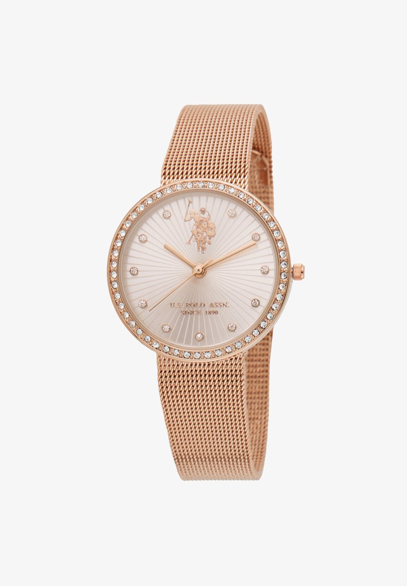 Orologio a rete rose gold con un quadrante bianco testurizzato, accenti simili a diamanti e cassa rotonda. Presenta un logo e semplici indici delle ore.