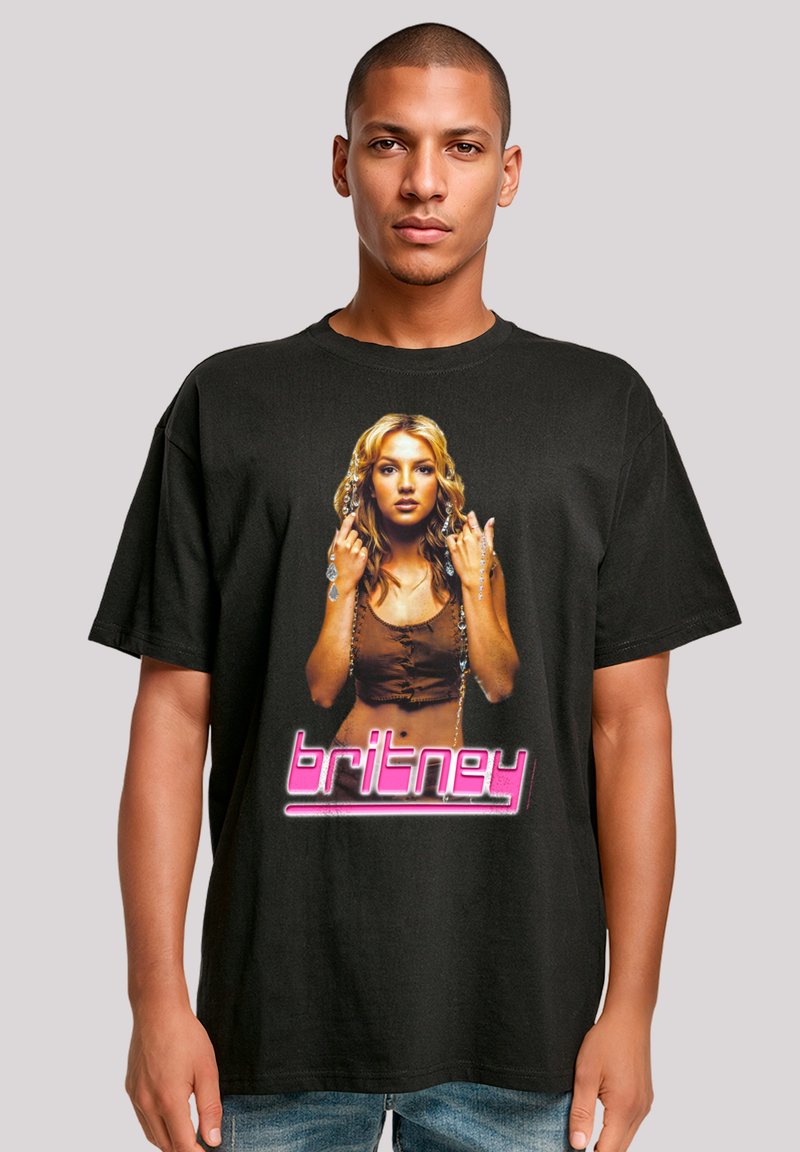 Black cotton t-shirt featuring a graphic print of a woman, with text reading "britney" in pink, bold font below the image.
