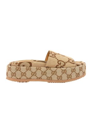 Beige platformsandal med brunt sammenflettet G-mønster og tyk sål, åben tå og bred rem over fronten.
