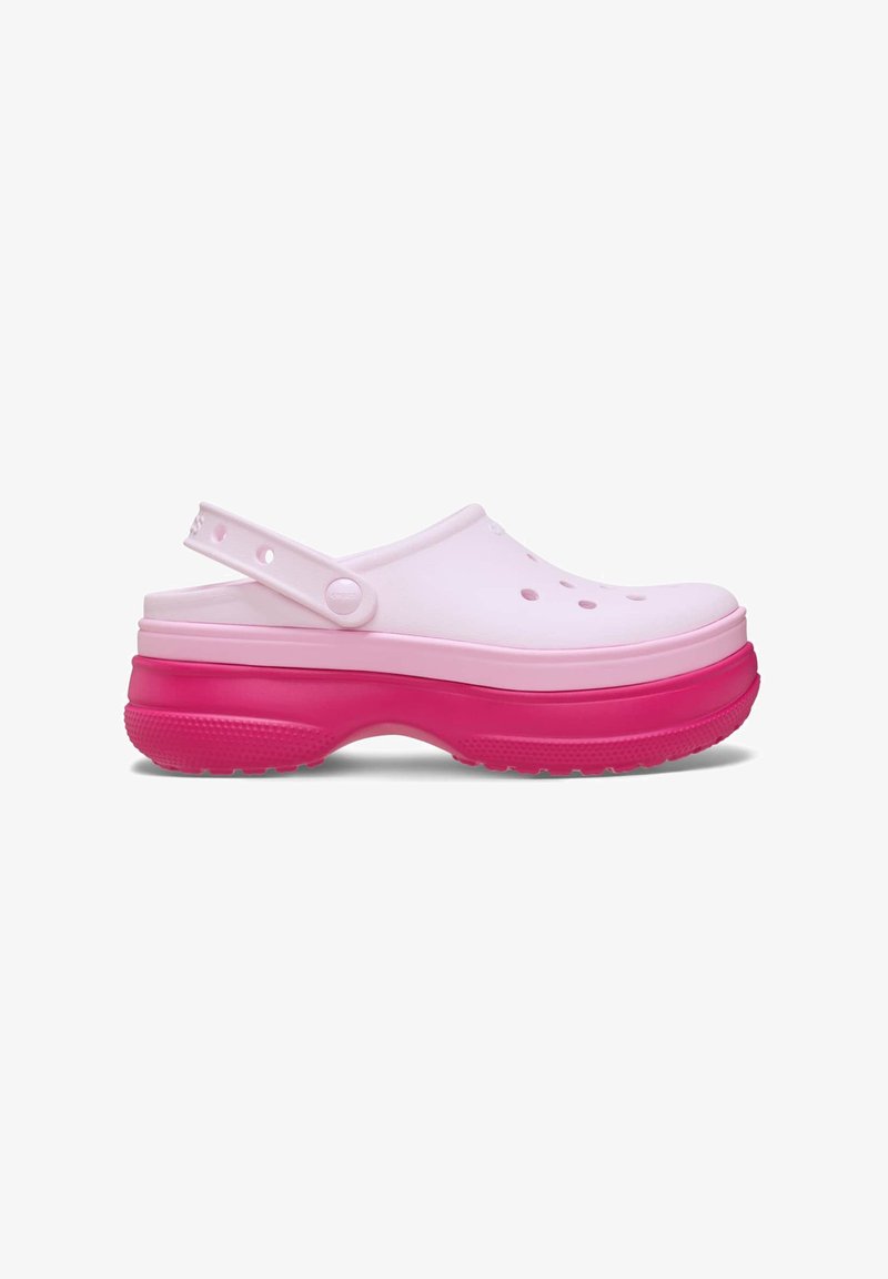 Zoccoli rosa e bianchi con punta chiusa, cinturino posteriore regolabile e fori perforati per ventilazione. Suola spessa rosa per un'ammortizzazione comoda.