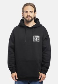 Felpa nera con cappuccio realizzata in misto cotone, dotata di stringhe di regolazione e tasca frontale. Presenta un logo grafico bianco sul petto e un accento arcobaleno sull'orlo.