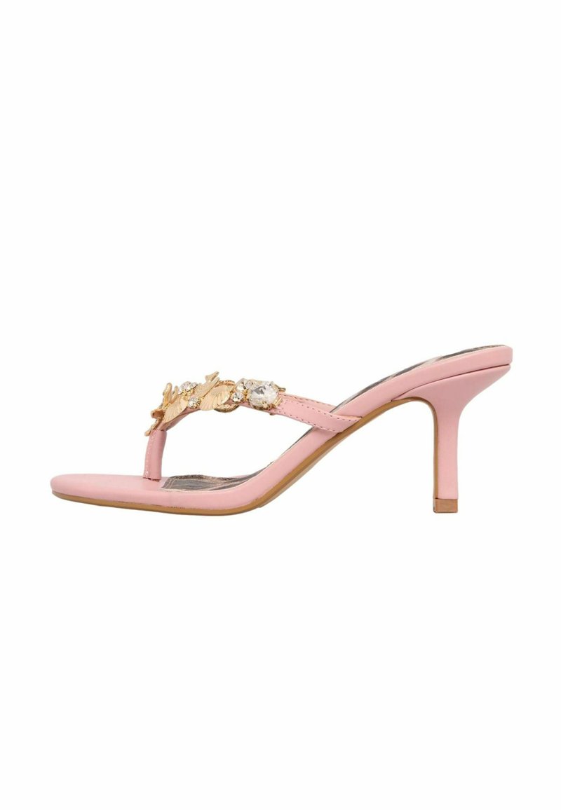 Sandali con tacco rosa con una sottile cinghia e decorazioni floreali con accenti trasparenti. Materiale liscio, punta a punta e design con tacco sottile.