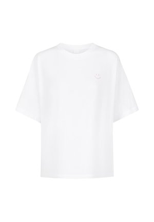 White cotton t-shirt with a relaxed fit, short sleeves, and a small pink smiley face graphic on the left chest area.