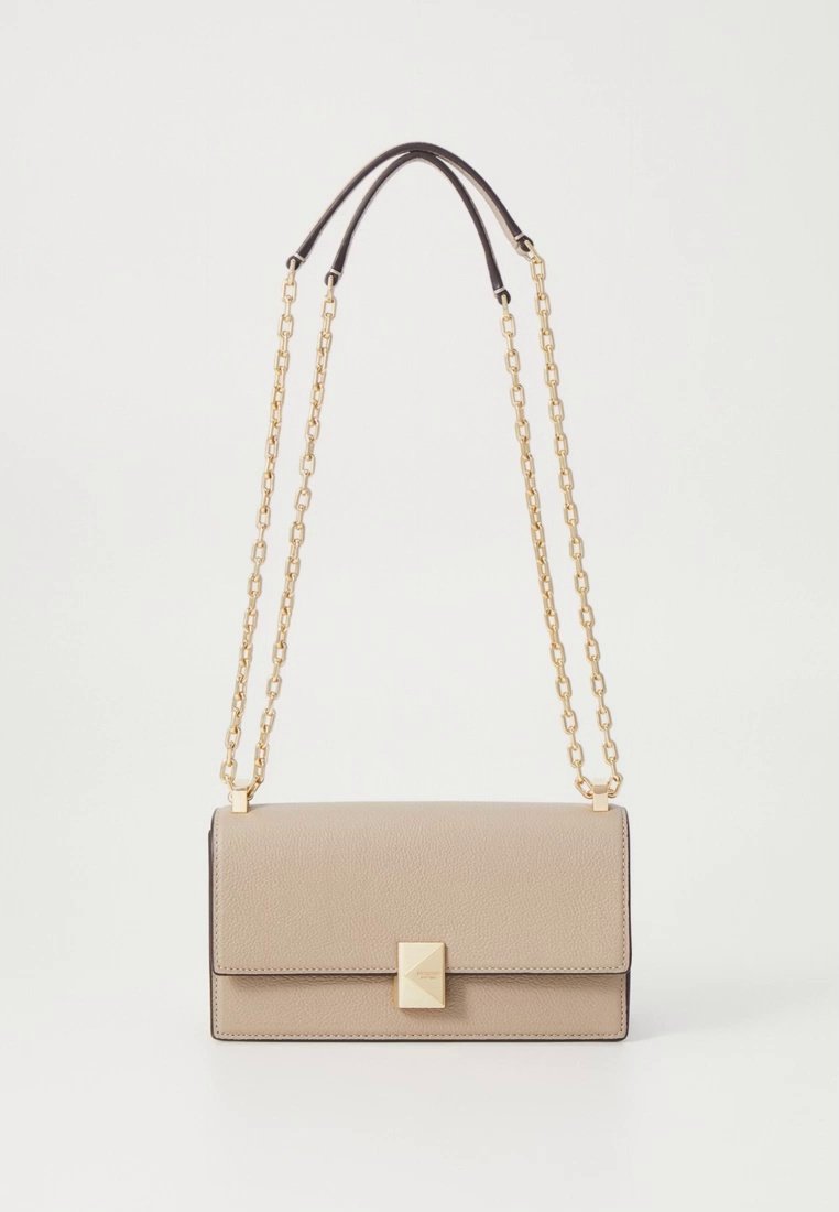 Beige textured leather handbag with a rectangular shape, gold chain strap, and a prominent gold geometric clasp on the front.