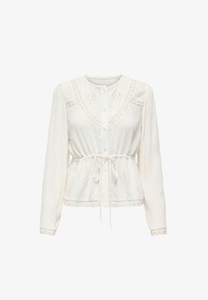 White, long-sleeve blouse with a button front, drawstring waist, and lace trim. Features embroidered patterns on a textured fabric.