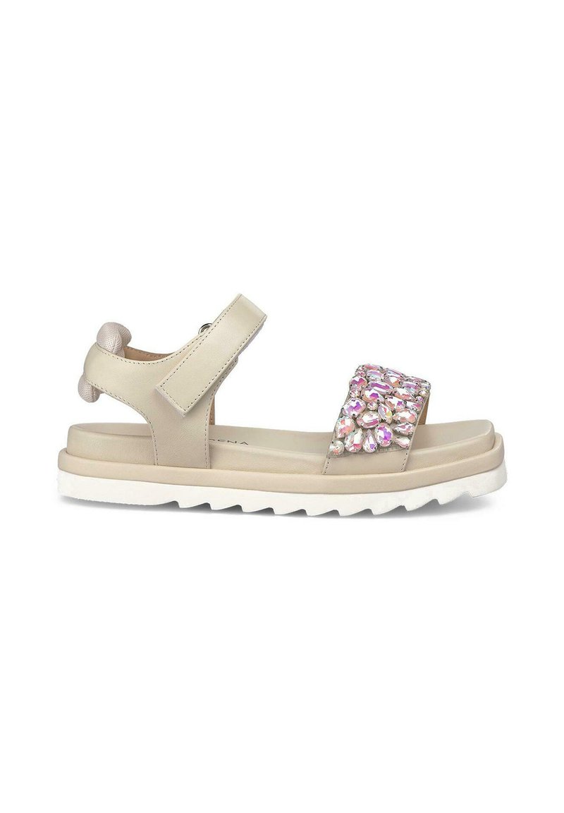 Beige sandals with a textured upper, adjustable strap, and embellished with pink and clear crystals on the band. White rubber sole with tread.