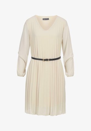 Kreminės spalvos suknelė su V formos iškirpte, ilgomis rankovėmis, klostuotu audiniu ir juoda juosta, sutraukiančia liemenį. Lygus paviršius ir kelių ilgio.