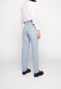 Levi's® Těhotenské džíny - bleached denim