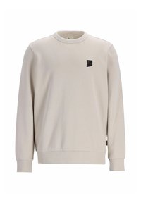 Felpa beige chiaro realizzata in tessuto morbido, con maniche lunghe, colletto a girocollo e un piccolo patch con logo nero sul lato sinistro del petto.