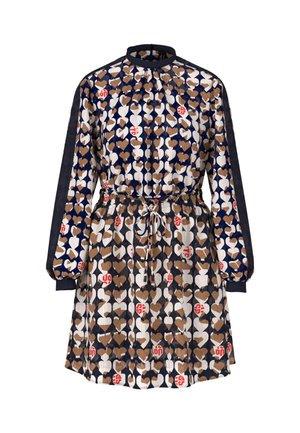 Printed dress with a high collar and long sleeves, featuring a heart pattern in brown, white, and navy. Drawstring waist and gathered cuffs.