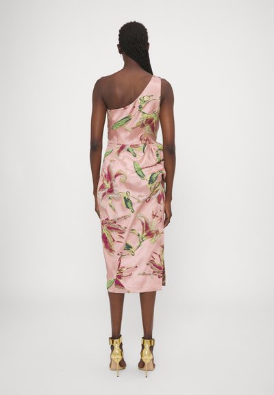 One-shoulder pink satin dress with a floral pattern featuring green leaves and red lilies; side ruching; knee-length. Gold heeled shoes.