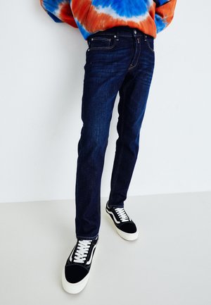 Jeans Tapered Fit - dark-blue denim