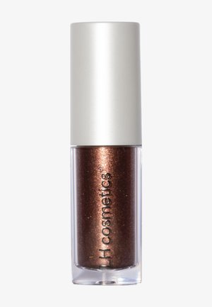 Huulikiiltoputkilo, jossa metallinhohtoinen pronssinvärinen sävy ja valkoinen korkki, merkintä "LH cosmetics" kirkkaassa astiassa.