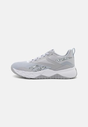 Light grey athletic shoes with mesh upper, textured accents, white sole, and subtle zebra-pattern detailing on the side.
