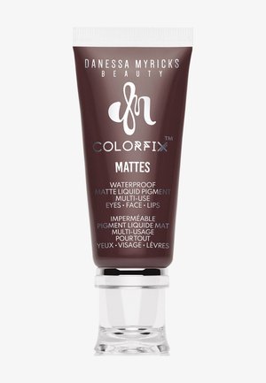 Danessa Myricks Beauty Colorfix Mattes wasserdichtes mattes Flüssigpigment für Augen, Gesicht und Lippen in einem dunklen braunen Röhrchen mit klarem Deckel.