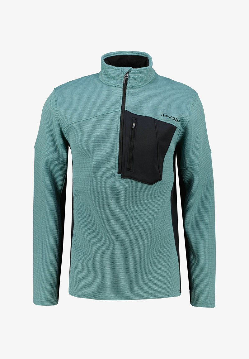 Pullover in pile di un blu teal chiaro con tasca sul petto nera, colletto alto e tessuto testurizzato. Presenta maniche lunghe e chiusura con zip.