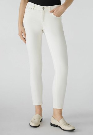 Weiße, schmale Jeans aus elastischem Baumwollmix, mit einem klassischen Fünf-Taschen-Design und einem Reißverschluss mit Knopfverschluss.