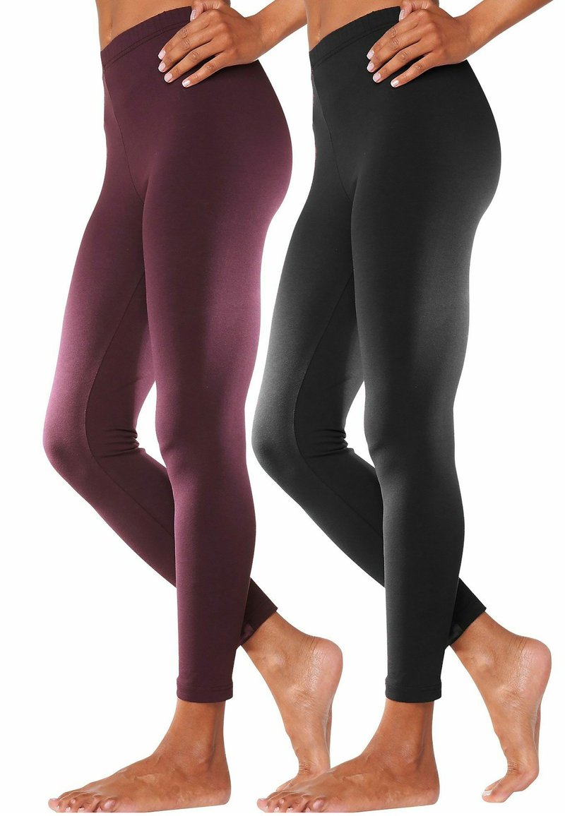 Twee paren strakke leggings: één bordeauxrood en één zwart. Beide hebben een gladde textuur en een elastische tailleband, reiken tot de enkel.