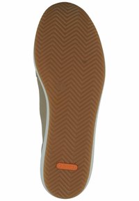 Brown rubber shoe sole with a herringbone pattern, featuring a white edge and orange "dynergy" logo. Smooth texture and rounded shape.