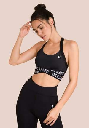 BEAUTY - Reggiseno sportivo con sostegno medio - black