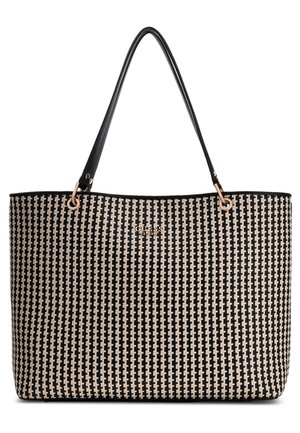 Black and beige woven tote bag with long black handles and gold-toned "GUESS" logo on front center.